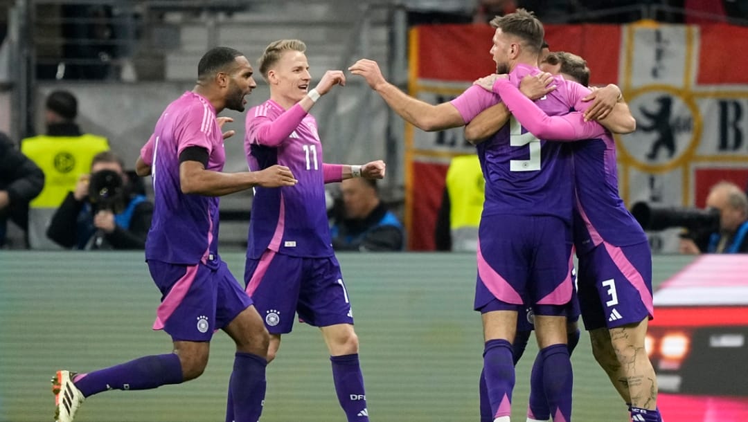 Germany's Niclas Fullkrug celebrates with teammates after scoring his sides second goal during the international friendly soccer match between Germany and Netherlands at the Deutsche Bank Park in Frankfurt, Germany on Tuesday, March 26, 2024.