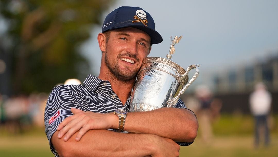 Bryson DeChambeau holds the trophy after winning the U.S. Open golf tournament Sunday, June 16, 2024, in Pinehurst, N.C.