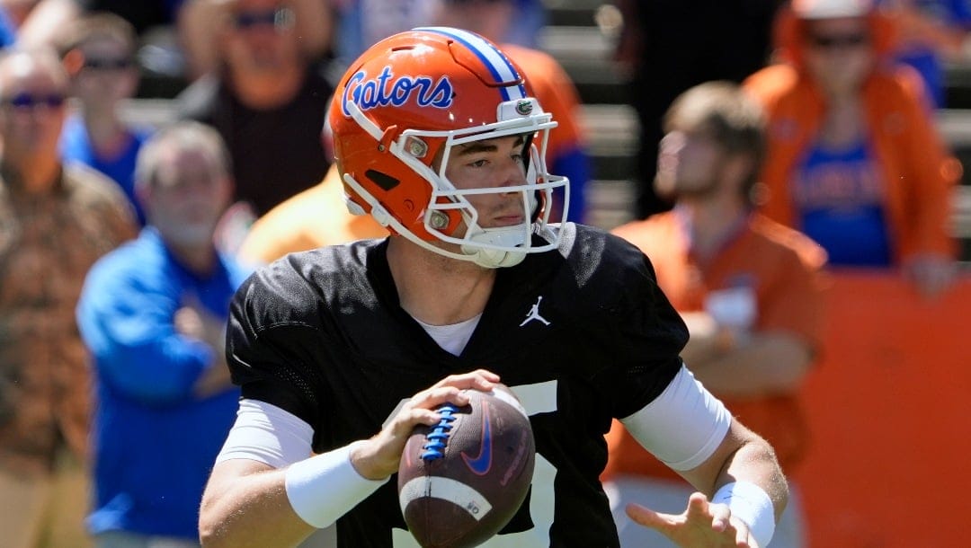 Florida quarterback Graham Mertz looks for a receiver during the NCAA college football team's spring game, Saturday, April 13, 2024, in Gainesville, Fla. (AP Photo/John Raoux)