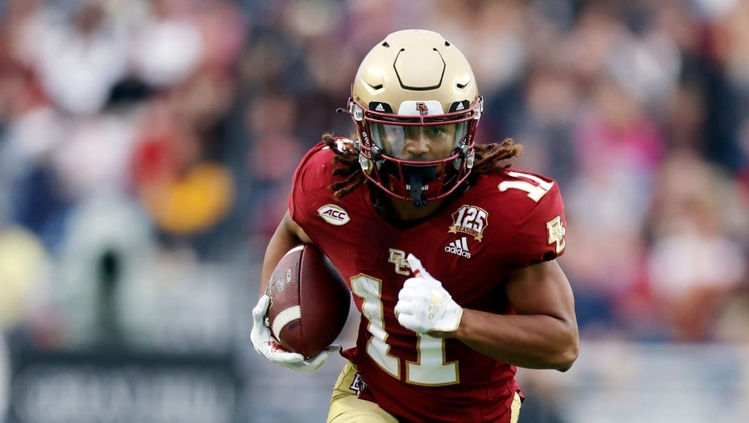 Boston College wide receiver Lewis Bond (11) runs for a touchdown during the second half of an NCAA college football game against Virginia, Saturday, Sept. 30, 2023, in Boston. (AP Photo/Michael Dwyer)