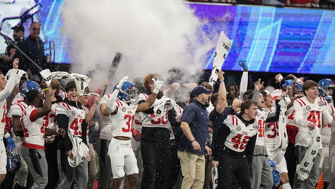 The Mississippi sidelines celebrate a touchdown against Penn State during the first half of the Peach Bowl NCAA college football game, Saturday, Dec. 30, 2023, in Atlanta.