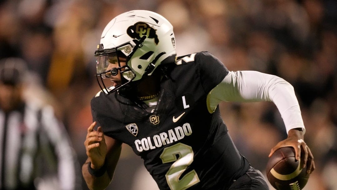 Colorado quarterback Shedeur Sanders (2) in the second half of an NCAA college football game Saturday, Nov. 4, 2023, in Boulder, Colo. (AP Photo/David Zalubowski)