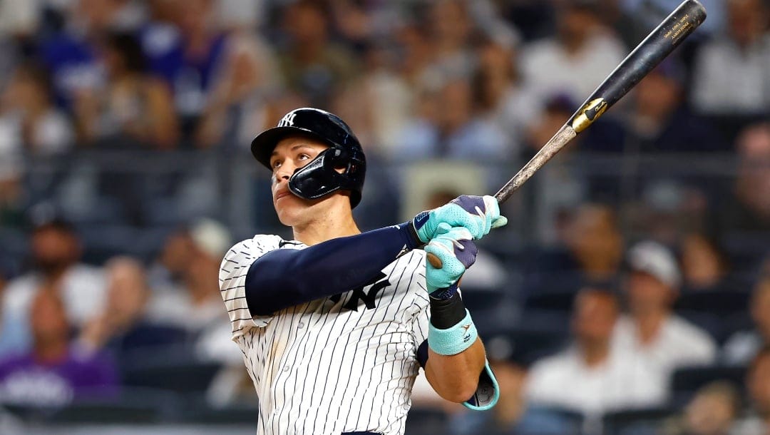 New York Yankees' Aaron Judge follows through on a home run against the Los Angeles Dodgers during the eighth inning of a baseball game, Sunday, June 9, 2024, in New York.