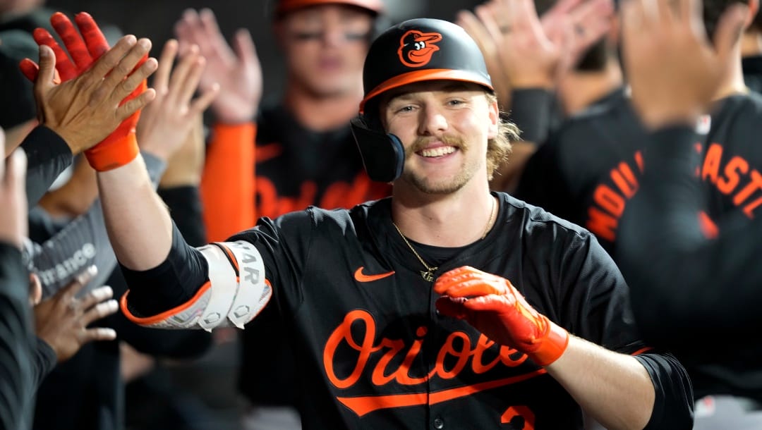 Baltimore Orioles' Gunnar Henderson is greeted in the dugout after his two-run home run off Chicago White Sox starting pitcher Chris Flexen during the fifth inning of a baseball game Friday, May 24, 2024, in Chicago.