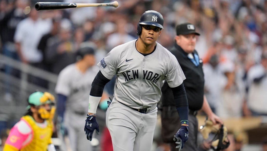 New York Yankees' Juan Soto tosses his bat after hitting a two-run home run during the third inning of a baseball game against the San Diego Padres, Friday, May 24, 2024, in San Diego.