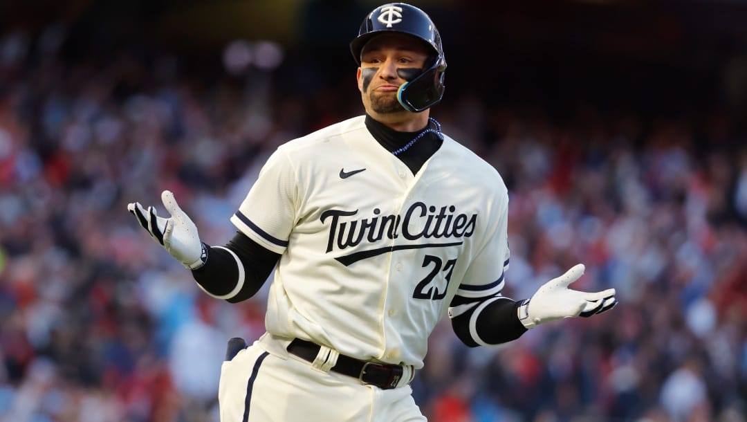 Minnesota Twins' Royce Lewis reacts towards the dugout after a solo home run during the first inning of Game 4 of a baseball AL Division Series against the Houston Astros, Wednesday, Oct. 11, 2023, in Minneapolis.