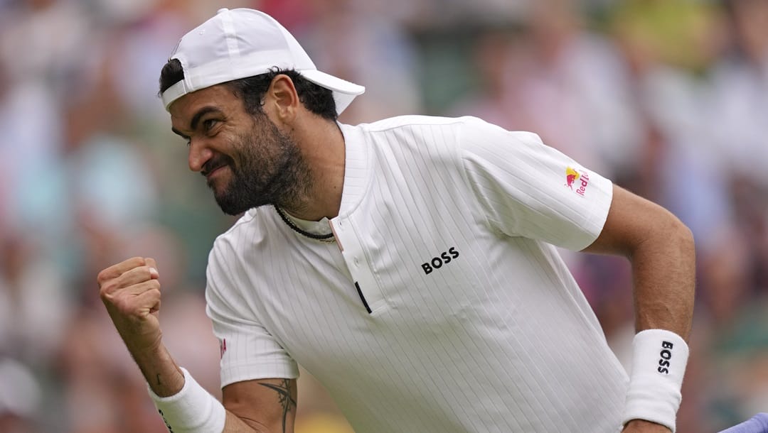 Italy's Matteo Berrettini reacts as he plays Spain's Carlos Alcaraz in a men's singles match on day eight of the Wimbledon tennis championships in London, Monday, July 10, 2023.