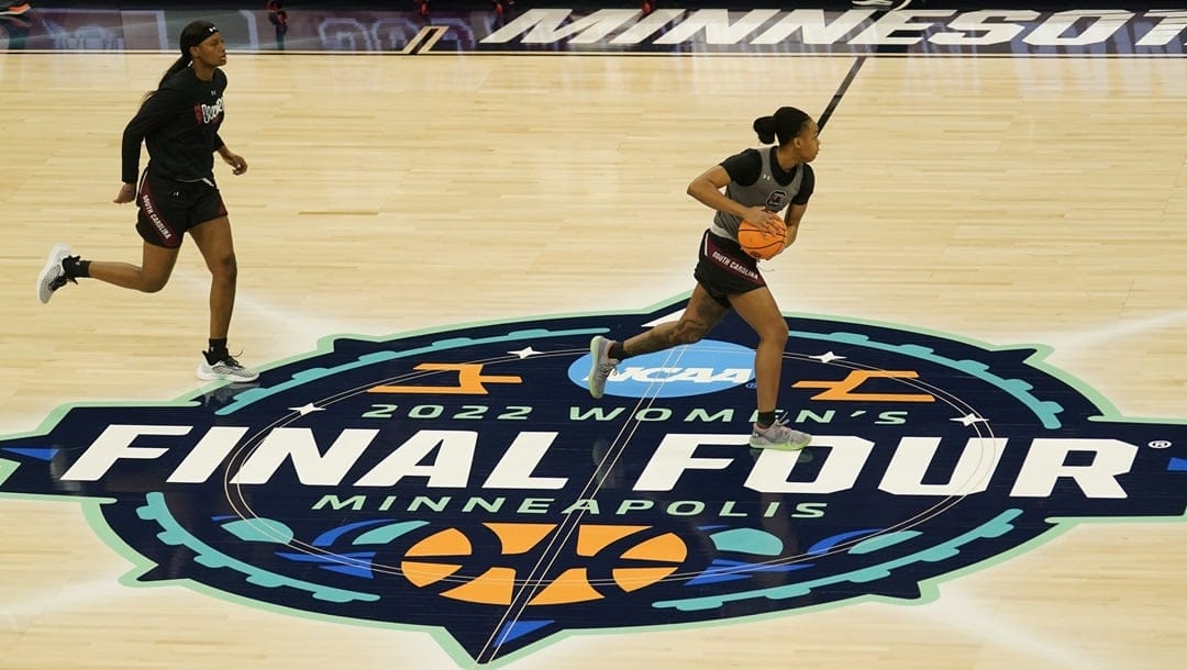 South Carolina players run during a practice session for a college basketball game in the semifinal round of the Women's Final Four NCAA tournament Thursday, March 31, 2022, in Minneapolis.