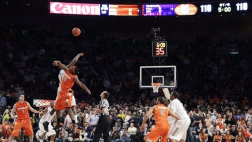 Syracuse's Paul Harris and Connecticut's Jeff Adrien battle for the tip at the start of the sixth period of overtime during a quarterfinal NCAA college basketball game at the Big East men's tournament Thursday, March 12, 2009 at Madison Square Garden in New York. Syracuse won 127-117.