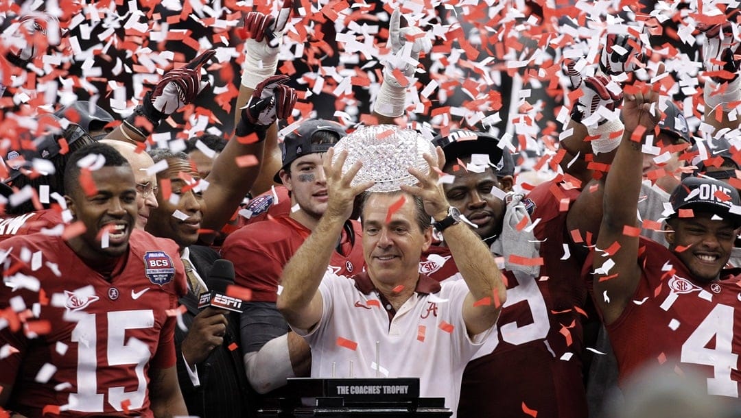 Alabama head coach Nick Saban celebrates with his team after the BCS National Championship college football game against LSU, Jan. 9, 2012, in New Orleans. Nick Saban, the stern coach who won seven national championships and turned Alabama back into a national powerhouse that included six of those titles in just 17 seasons, is retiring, according to multiple reports, Wednesday, Jan. 10, 2024.