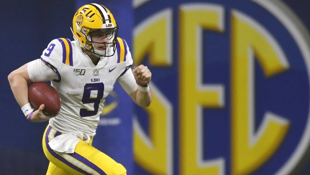 In this Dec. 7, 2019, file photo, LSU quarterback Joe Burrow (9) runs against Georgia during the second half of the Southeastern Conference championship NCAA college football game, in Atlanta. The Southeastern Conference broke the NFL record for first-round draft picks by a conference. Fifteen players from the powerhouse league were selected in the opening round Thursday night, April 23, 2020.