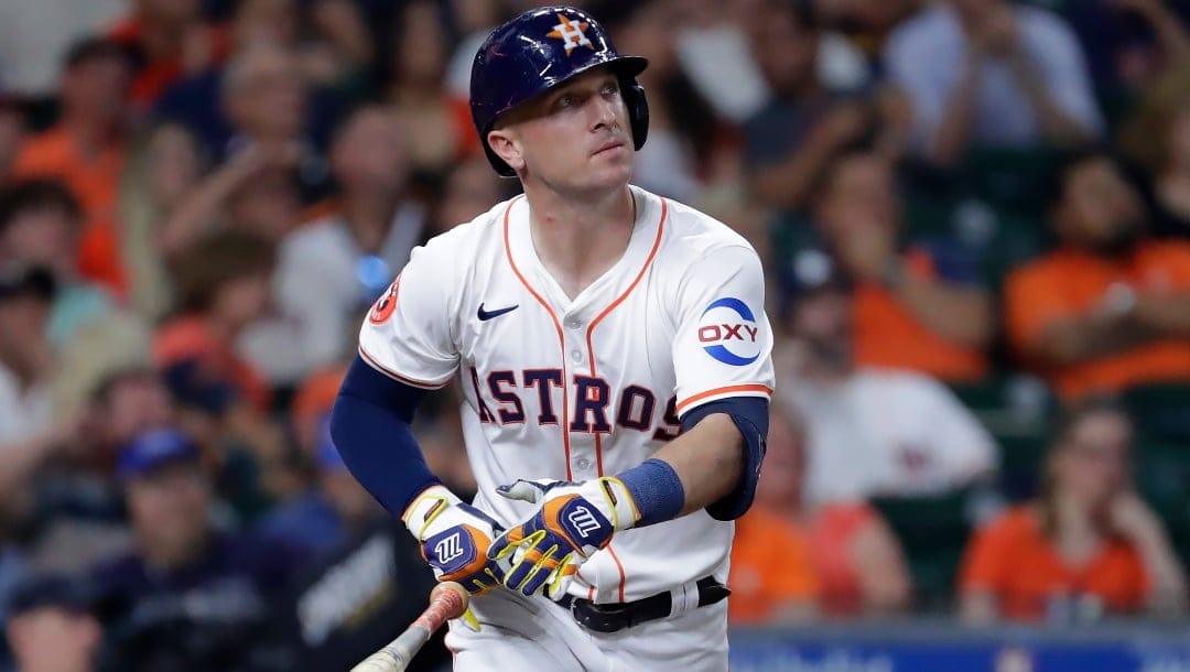 Houston Astros' Alex Bregman flips his bat as he watches his hit against the Los Angeles Angels during a baseball game Tuesday, May 21, 2024, in Houston.