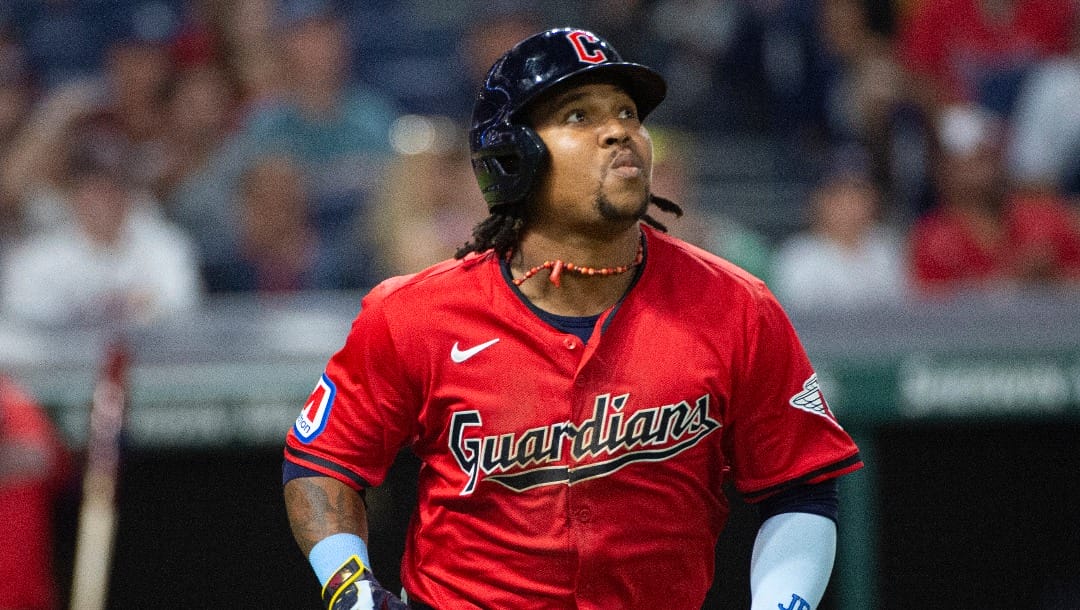 Cleveland Guardians' Jose Ramirez watches his solo home run off Texas Rangers relief pitcher Grant Anderson during the sixth inning of a baseball game in Cleveland, Saturday, Aug. 24, 2024. (AP Photo/Phil Long)