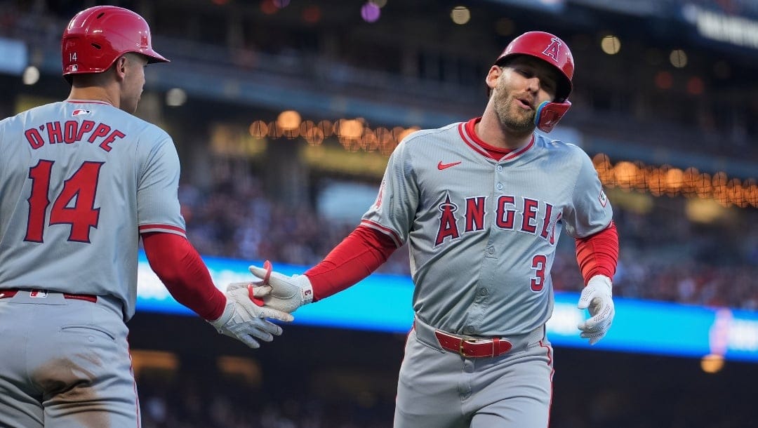 Los Angeles Angels' Taylor Ward, right, celebrates with Logan O'Hoppe after scoring against the San Francisco Giants during the third inning of a baseball game Friday, June 14, 2024, in San Francisco.