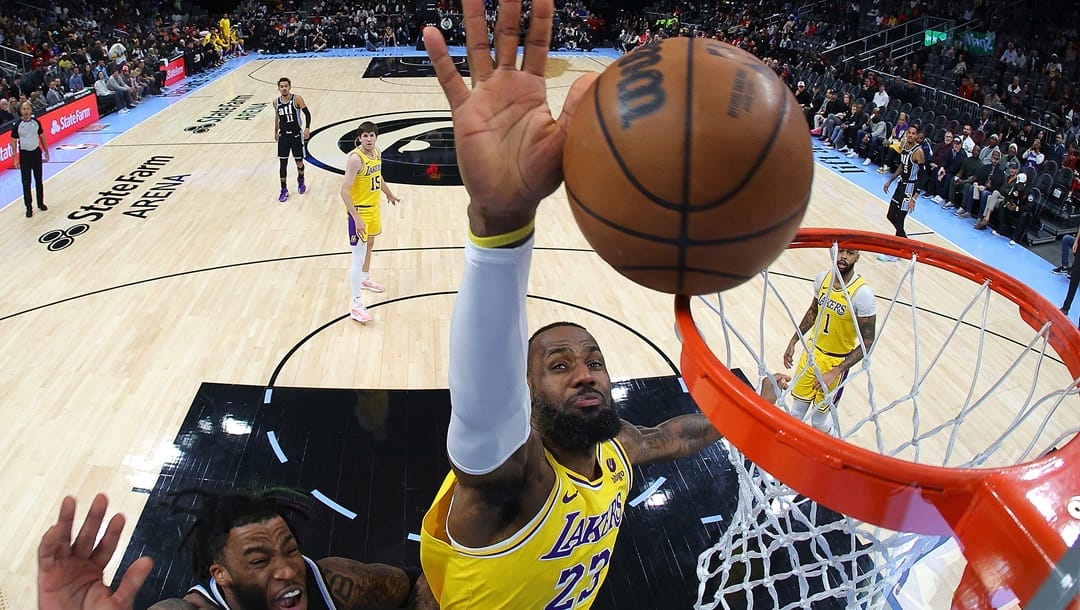 ATLANTA, GEORGIA - JANUARY 30: LeBron James #23 of the Los Angeles Lakers is called for goaltending as he blocks a shot by Saddiq Bey #41 of the Atlanta Hawks during the first quarter at State Farm Arena on January 30, 2024 in Atlanta, Georgia.