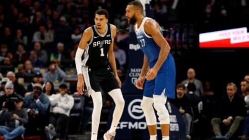 Victor Wembanyama #1 of the San Antonio Spurs defends against Rudy Gobert #27 of the Minnesota Timberwolves in the fourth quarter at Target Center on February 27, 2024 in Minneapolis, Minnesota.