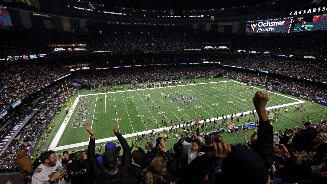 An interior elevated overall general view of the field of Caesars Superdome as fans cheer during an NFL football game between the New Orleans Saints and the Atlanta Falcons, Sunday, Jan. 7, 2024, in New Orleans. (AP Photo/Tyler Kaufman)