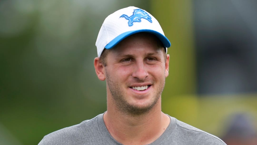 Detroit Lions quarterback Jared Goff smiles walking off the field after an NFL football practice in Allen Park, Mich., Monday, July 29, 2024. (AP Photo/Paul Sancya)