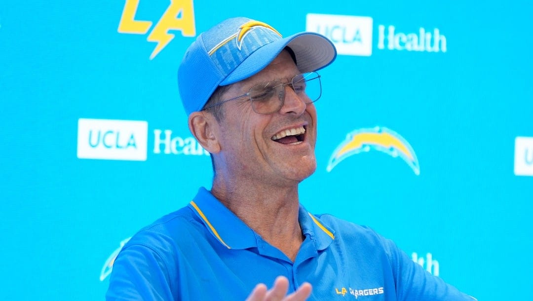 Los Angeles Chargers head coach Jim Harbaugh fields questions during NFL football training camp Wednesday, July 24, 2024, in El Segundo, Calif. (AP Photo/Marcio Jose Sanchez)