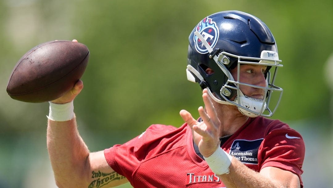 Tennessee Titans quarterback Will Levis (8) looks to throw a pass during NFL football practice Thursday, June 6, 2024, in Nashville, Tenn. (AP Photo/George Walker IV)