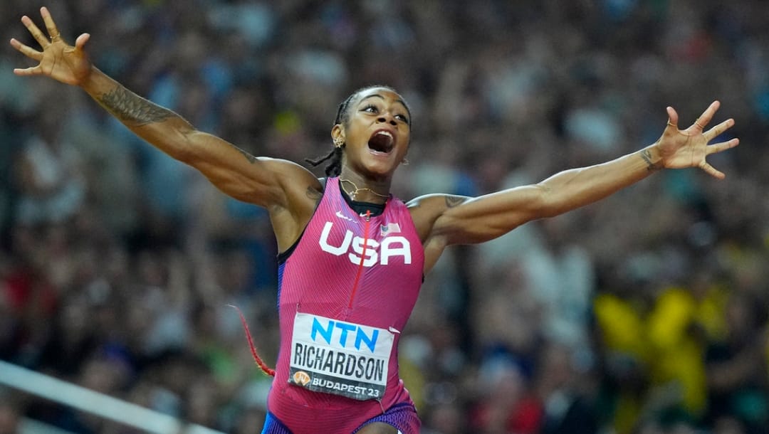 FILE - Sha'Carri Richardson, of the United States, celebrates after winning the gold medal in the final of the Women's 100-meters during the World Athletics Championships in Budapest, Hungary, Aug. 21, 2023.