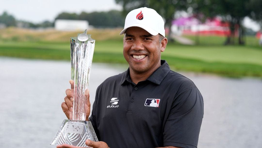 Jhonattan Vegas holds the trophy after winning the 3M Open golf tournament at the Tournament Players Club, Sunday, July 28, 2024, in Blaine, Minn.