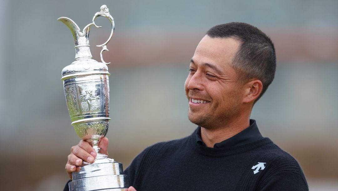 Xander Schauffele of the United States holds the Claret Jug trophy after winning the British Open Golf Championships at Royal Troon golf club in Troon, Scotland, Sunday, July 21, 2024.