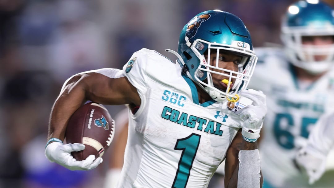 Coastal Carolina running back Braydon Bennett (1) carries against San Jose State during the first half of the Hawaii Bowl NCAA college football game, Saturday, Dec. 23, 2023, in Honolulu. (AP Photo/Marco Garcia)