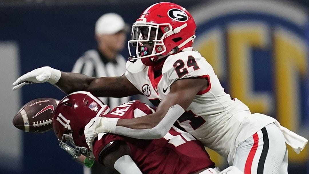 Alabama wide receiver Malik Benson (11) misses a pass against Georgia defensive back Malaki Starks (24) during the first half of the Southeastern Conference championship NCAA college football game in Atlanta, Saturday, Dec. 2, 2023.