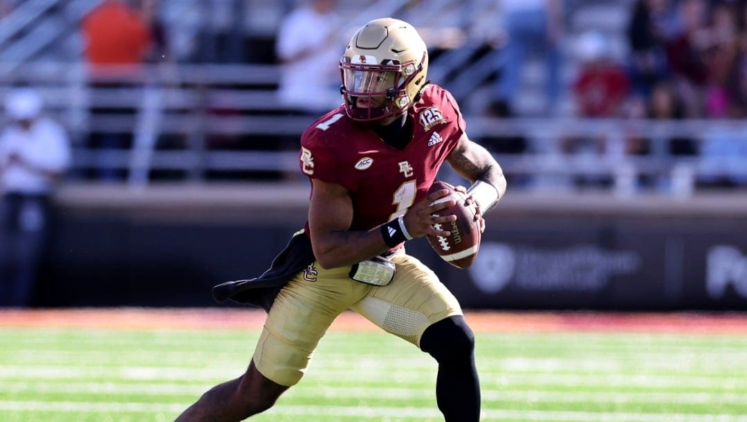 Boston College quarterback Thomas Castellanos (1) rolls out during the second half of an NCAA college football game against UConn Saturday, Oct. 28, 2023 in Boston. (AP Photo/Mark Stockwell)