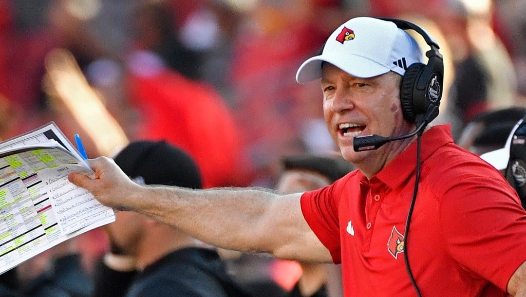 FILE - Louisville head coach Jeff Brohm shouts instructions to his team during the first half of an NCAA college football game in Louisville, Ky., Saturday, Sept. 23, 2023. Louisville enters without Jack Plummer, who led Jeff Brohm's first-year program to its first ACC title game berth. (AP Photo/Timothy D. Easley, FIle)