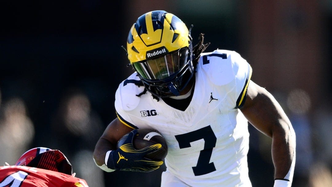 Michigan running back Donovan Edwards (7) in action during the first half of an NCAA college football game against Maryland, Saturday, Nov. 18, 2023, in College Park, Md. (AP Photo/Nick Wass)