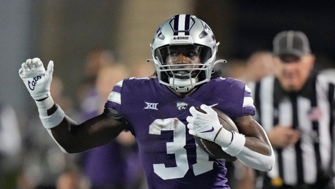 Kansas State running back DJ Giddens runs the ball during the first half of an NCAA college football game against TCU Saturday, Oct. 21, 2023, in Manhattan, Kan. (AP Photo/Charlie Riedel)