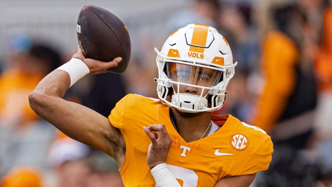 Tennessee quarterback Nico Iamaleava (8) throws to a receiver during warmups before an NCAA college football game against Vanderbilt Saturday, Nov. 25, 2023, in Knoxville, Tenn. (AP Photo/Wade Payne)