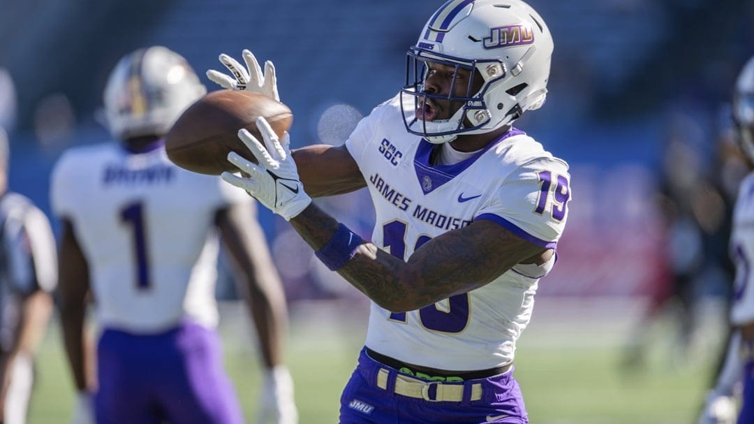 James Madison wide receiver Taji Hudson (19) catches a ball during warmups before an NCAA college football game against Georgia State, Saturday, Nov. 4 2023, in Atlanta, Ga.