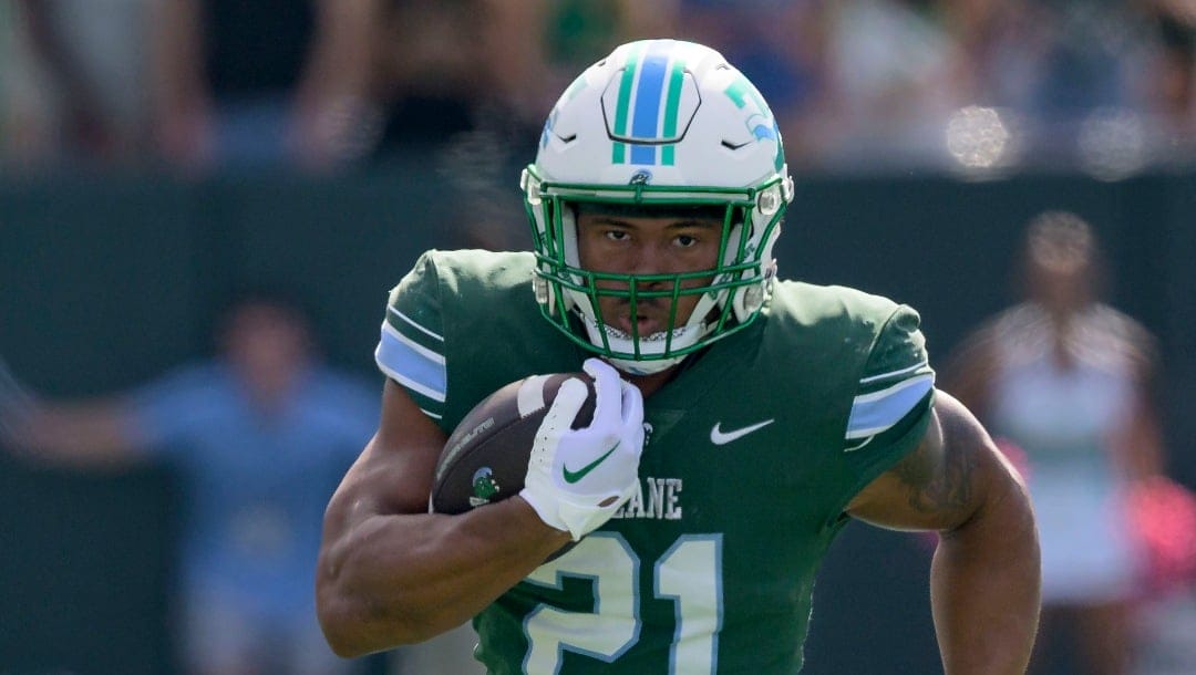 Tulane running back Makhi Hughes (21) runs during an NCAA football game against North Texas on Saturday, Oct. 21, 2023, in New Orleans. (AP Photo/Matthew Hinton)