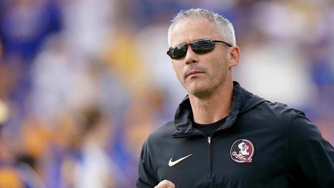 Florida State head coach Mike Norvell enters the field before an NCAA college football game against Pittsburgh in Pittsburgh, Saturday, Nov. 4, 2023. (AP Photo/Matt Freed)