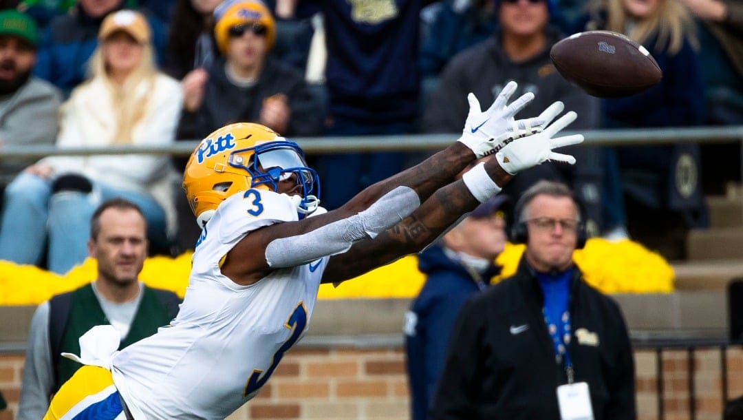 Pittsburgh wide receiver Daejon Reynolds (3) tries to make a catch during the first half of an NCAA college football game against Notre Dame Saturday, Oct. 28, 2023, in South Bend, Ind. (AP Photo/Michael Caterina)