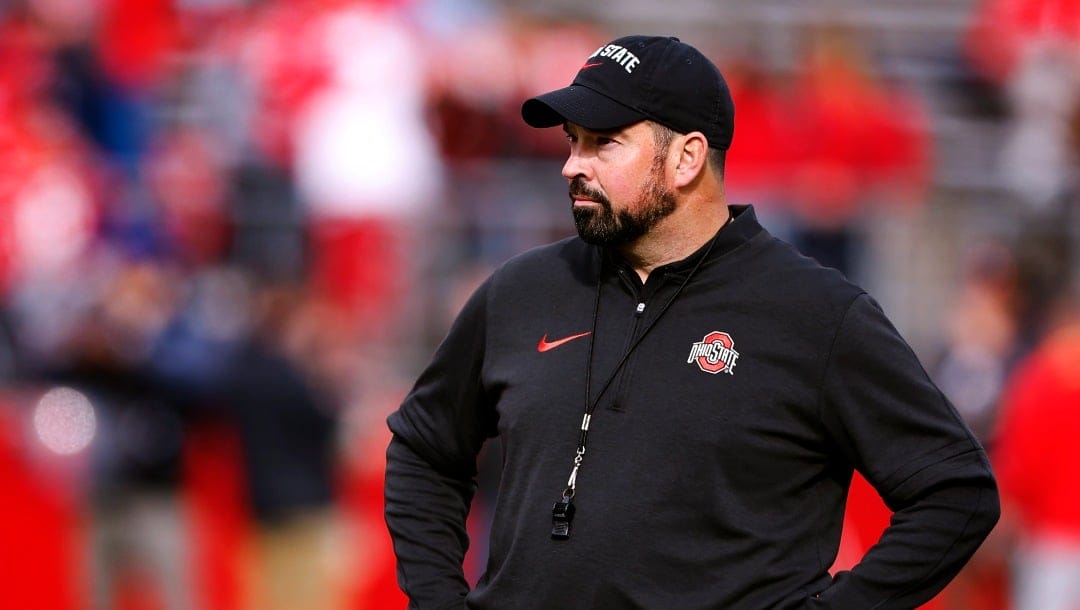 Ohio State head coach Ryan Day observes Rutgers during warm up before a NCAA college football game, Saturday, Nov. 3, 2023, in Piscataway, N.J. (AP Photo/Noah K. Murray)