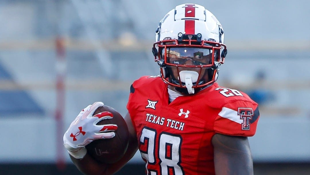 Texas Tech running back Tahj Brooks (28) runs the ball against Oregon during the first half of an NCAA college football game, Saturday, Sept. 9, 2023, in Lubbock, Texas. (AP Photo/Chase Seabolt)