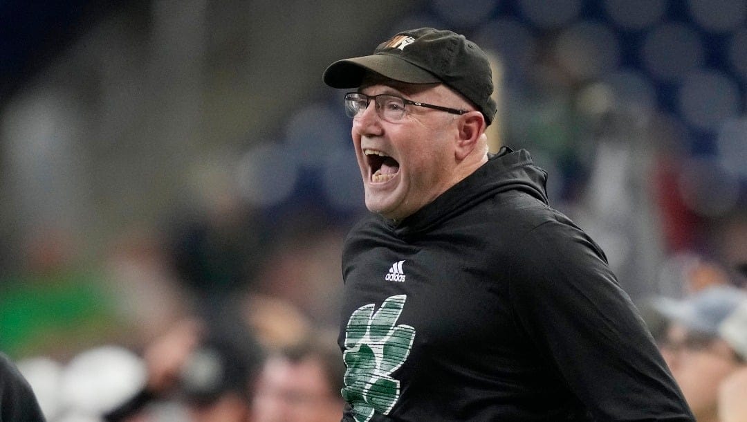 Ohio head coach Tim Albin yells from the sideline during the first half of the Mid-American Conference championship NCAA college football game against Toledo, Saturday, Dec. 3, 2022, in Detroit. (AP Photo/Carlos Osorio)