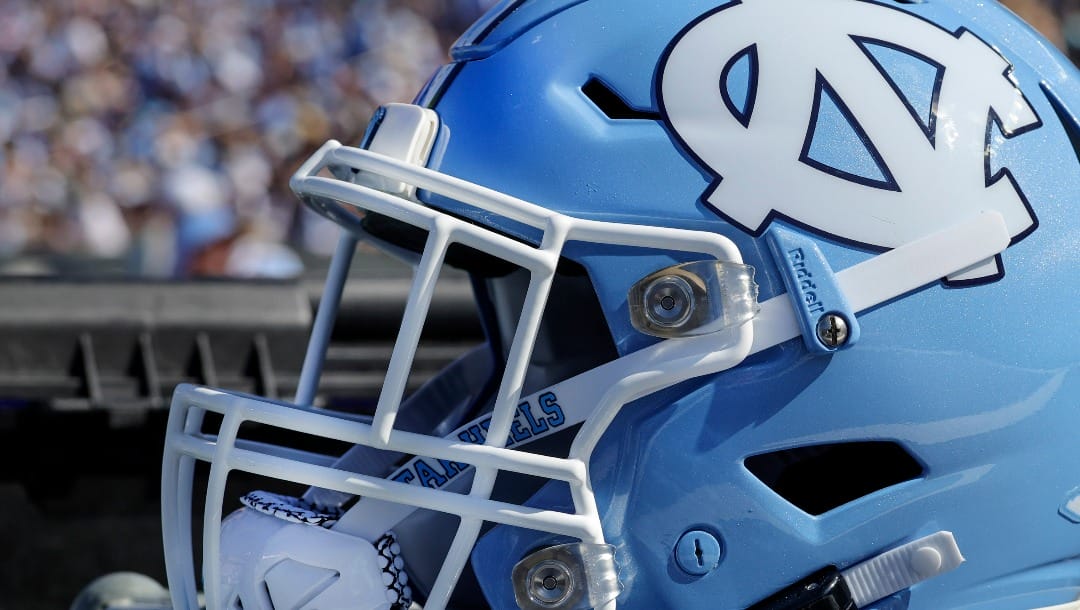 North Carolina helmet sits on the bench during the first quarter of an NCAA college football game against Minnesota, Saturday, Sept. 16, 2023, in Chapel Hill, N.C. (AP Photo/Reinhold Matay)