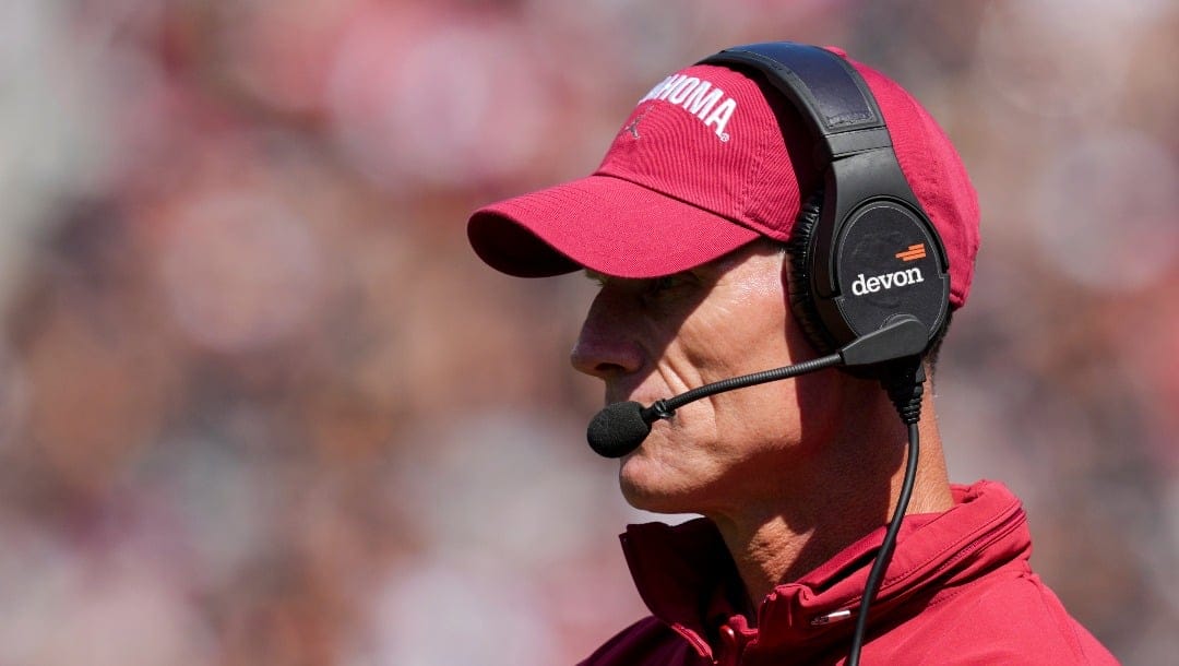 Oklahoma head coach Brent Venables watches from the sideline during the first half of an NCAA college football game against Cincinnati, Saturday, Sept. 23, 2023, in Cincinnati. (AP Photo/Aaron Doster)