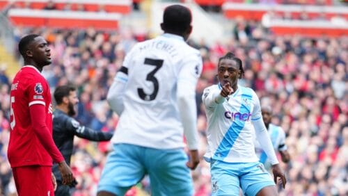 Crystal Palace's Eberechi Eze, right, celebrates after scoring his side's opening goal during the English Premier League soccer match between Liverpool and Crystal Palace at Anfield Stadium in Liverpool, England, Sunday, April 14, 2024.