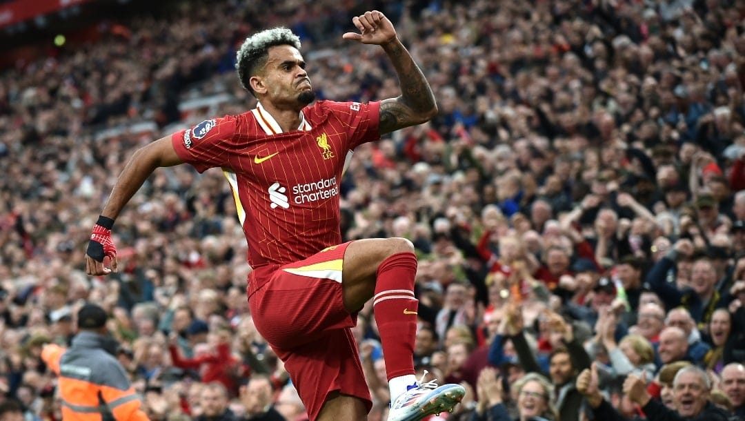 Liverpool's Luis Diaz celebrates after scoring his side's opening goal during the English Premier League soccer match between Liverpool and Brentford at Anfield Stadium, Liverpool, England, Sunday, Aug. 25, 2024.