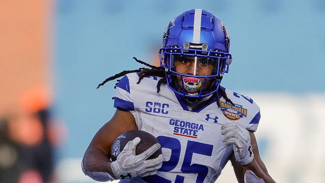 Georgia State running back Freddie Brock (25) runs with the ball against Utah State in the first half of the Famous Idaho Potato Bowl NCAA college football game, Saturday, Dec. 23, 2023, in Boise, Idaho. Georgia State won 45-22. (AP Photo/Steve Conner)