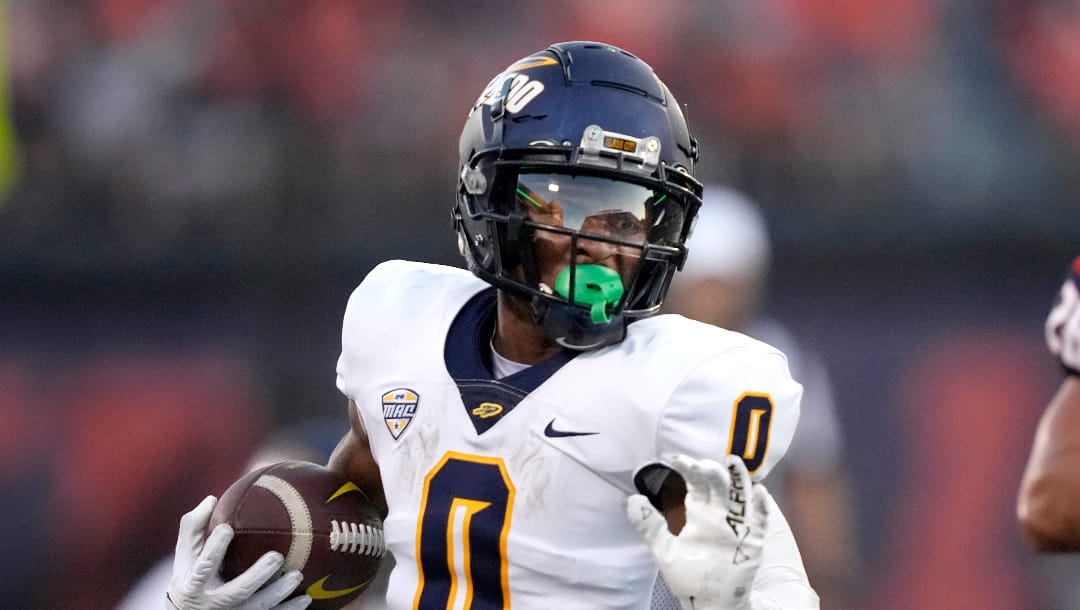 Toledo running back Jacquez Stuart carries the ball during an NCAA college football game against Illinois Saturday, Sept. 2, 2023, in Champaign, Ill. (AP Photo/Charles Rex Arbogast)