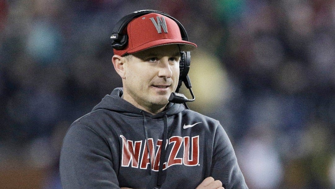 Washington State head coach Jake Dickert stands on the field during a break in play in the first half of an NCAA college football game against Colorado, Friday, Nov. 17, 2023, in Pullman, Wash. (AP Photo/Young Kwak)