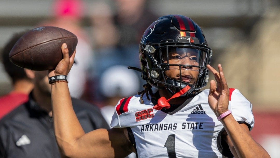 Arkansas State quarterback Jaylen Raynor (1) warms up before an NCAA football game against Troy on Saturday, Oct. 7, 2023, in Troy, Ala. (AP Photo/Vasha Hunt)