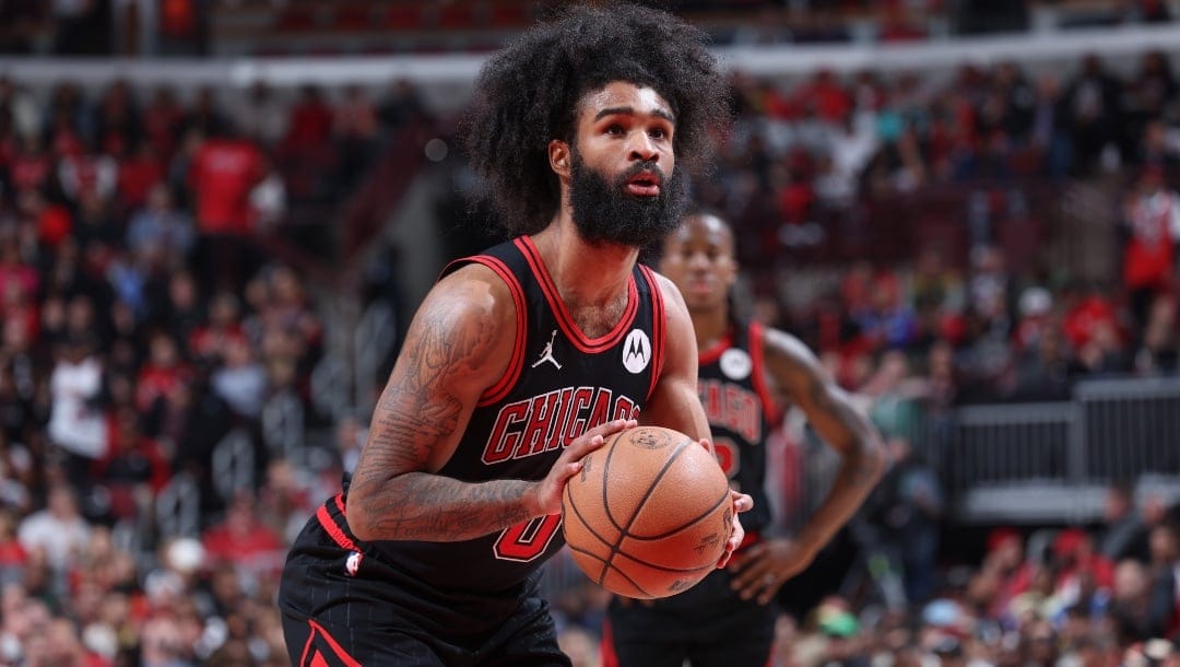 Coby White #0 of the Chicago Bulls shoots a free throw during the game against the Atlanta Hawks during the 2024 Play-In Tournament on April 17, 2024 at United Center in Chicago, Illinois.